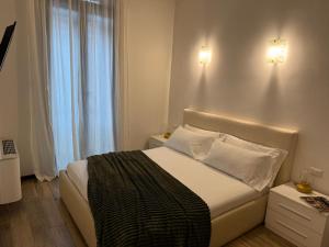 Giường trong phòng chung tại Residence Principe di Saronno +24 ảnh