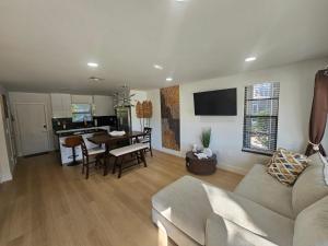 a living room with a couch and a table at Day Dreams Key Largo in Key Largo