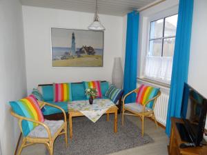 TV a/nebo společenská místnost v ubytování An't Fischerspad