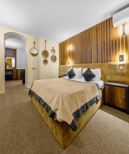 Ένα ή περισσότερα κρεβάτια σε δωμάτιο στο Onze Boutique Hotel Baku