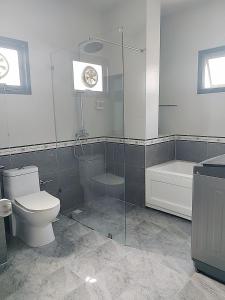 a bathroom with a shower and a toilet and a tub at Venice 3 bedroom, 3 bathroom, single family villa in Ban Nong Chaeng