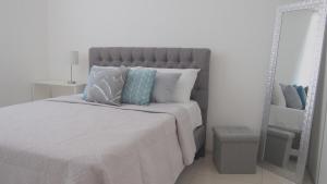 Postel nebo postele na pokoji v ubytování Bambú Luxury Stay-10 min from Airport