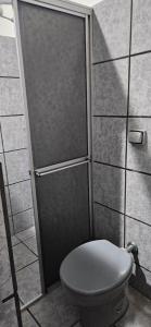 a shower with a toilet in a bathroom at Hotel Pasettus in Bela Vista do Paraíso +61 photos