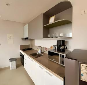 Кухня или мини-кухня в Moderna suite cerca del mar
