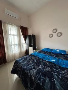 Ένα ή περισσότερα κρεβάτια σε δωμάτιο στο Magnolia Homestay