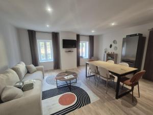a living room with a couch and a table at #Le 2 Paris # Thiers # in Thiers