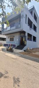 a motorcycle parked in front of a building at Hampi Icon Palace in New Hampi