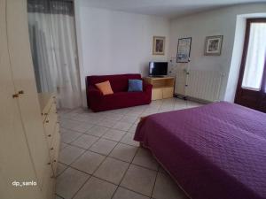 Ένα ή περισσότερα κρεβάτια σε δωμάτιο στο Affittacamere Ossola