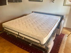 Ένα ή περισσότερα κρεβάτια σε δωμάτιο στο Gemütliche Wohnung Bergblick