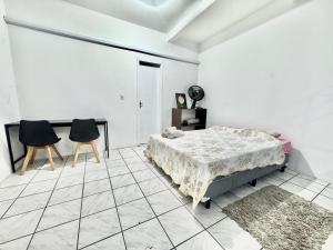 Postel nebo postele na pokoji v ubytování Estudio prático e acolhedor , sua base em Floripa + 7 fotografií