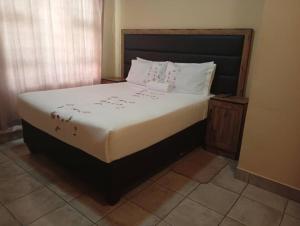 Ένα ή περισσότερα κρεβάτια σε δωμάτιο στο WilN Apartments