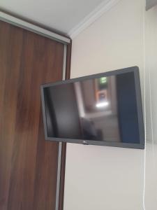 a flat screen tv hanging on a wall at Refugio de montaña in El Manzano