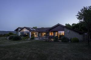 a house with a lot of windows at Lakeside in Compton Martin