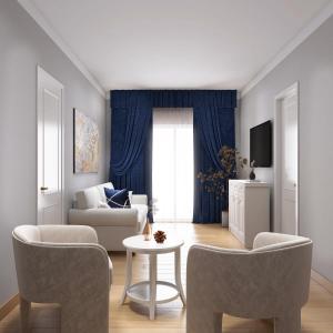 a living room with a couch and chairs and a table at Hotel Livata Mountain & Wellness in Subiaco