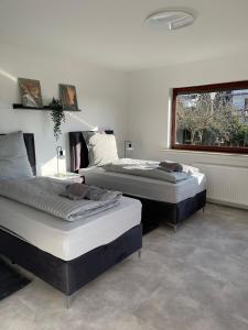 Postel nebo postele na pokoji v ubytování Haus am Osterholz