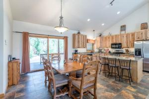 a kitchen with a large wooden table and chairs at Spacious Pet-Friendly Grand Lake House in Grand Lake