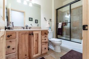 a bathroom with a sink and a toilet and a shower at Spacious Pet-Friendly Grand Lake House in Grand Lake +54 photos