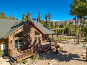 a log cabin with a porch and a yard at Spacious Pet-Friendly Grand Lake House in Grand Lake