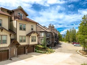 a row of houses with a driveway at 3 BR Fraser Apartment in Fraser