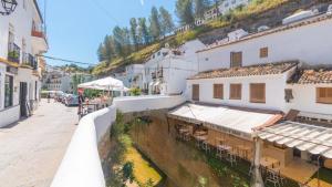 a view of a street in a town with buildings at Casa Abril by Ruralidays in Setenil
