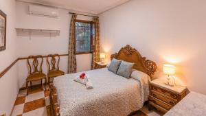Postel nebo postele na pokoji v ubytování Casa de Mis Dos Gitanillas Villafranca de Córdoba by Ruralidays + 21 fotografií