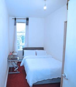 Postel nebo postele na pokoji v ubytování IziHome