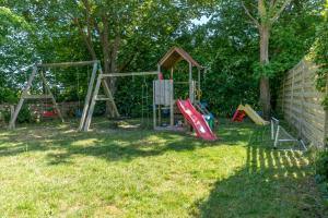 a group of playground equipment in a yard at Noorderburcht in Oosterend