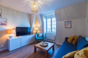 Televiisor ja/või meelelahutuskeskus majutusasutuses Escapade a Tregastel plages et commerces proches