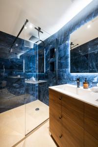 a bathroom with a sink and a shower at Duplex Suite Old Town in Antibes