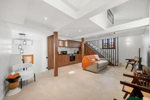 a living room with a couch and a kitchen at Duplex Suite Old Town in Antibes
