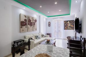 En eller flere senge i et værelse på Apartamento Aeropuerto Sevilla