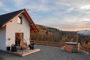 a cabin with a view of the mountains at Domki Widokowe Wisła in Wisła