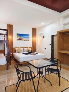 Ένα ή περισσότερα κρεβάτια σε δωμάτιο στο The Holiday Garden View