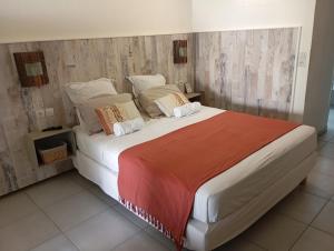 Postel nebo postele na pokoji v ubytování Bluehibiscus