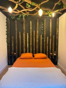 Ένα ή περισσότερα κρεβάτια σε δωμάτιο στο Cocoon Ny - DURBUY