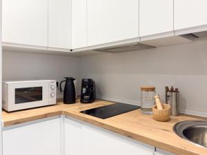 Η κουζίνα ή μικρή κουζίνα στο TAYP Navalmoral Apartamentos +14 φωτογραφίες