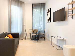 Μια τηλεόραση ή/και κέντρο ψυχαγωγίας στο TAYP Navalmoral Apartamentos