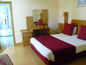 Cama ou camas em um quarto em Hotel Solneve