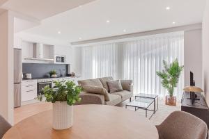 a living room with a couch and a table at Santa Lucía in A Coruña