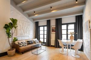 a living room with a couch and a table at ART Boutique in A Coruña