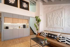 a living room with a couch and a table at ART Boutique in A Coruña