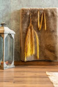 a bunch of tassels hanging on a wall at Golden Rooms in Ioannina +21 photos