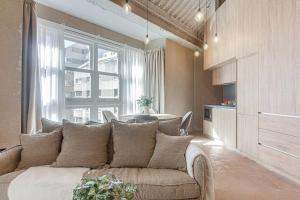 a living room with a couch and a table at Metropolitan Boutique in A Coruña