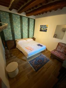 Ένα ή περισσότερα κρεβάτια σε δωμάτιο στο Rustichello G&P Tuscany