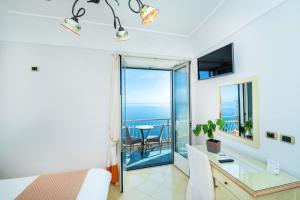 TV a/nebo společenská místnost v ubytování Locanda Degli Agrumi