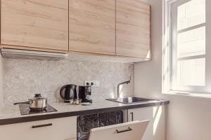 a kitchen with a sink and a counter top at Old Quarter Boutique in A Coruña