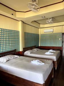 Ένα ή περισσότερα κρεβάτια σε δωμάτιο στο Friendship Guesthouse Dondet