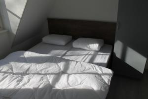 Ένα ή περισσότερα κρεβάτια σε δωμάτιο στο Hoge achterom