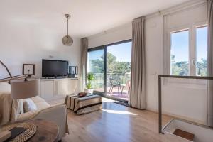 TV a/nebo společenská místnost v ubytování Casa Olivella #7 by Happy Houses Barcelona