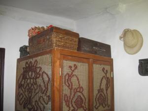 a wooden cabinet with a painting of crabs on it at Koryakivskyi Rai in Dmitrenki